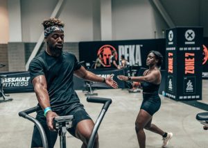 Men and woman in a DEKA functional fitness competition